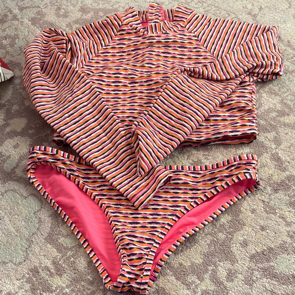 Athleta Vibrant Striped Zip-Up Top and swim bottoms